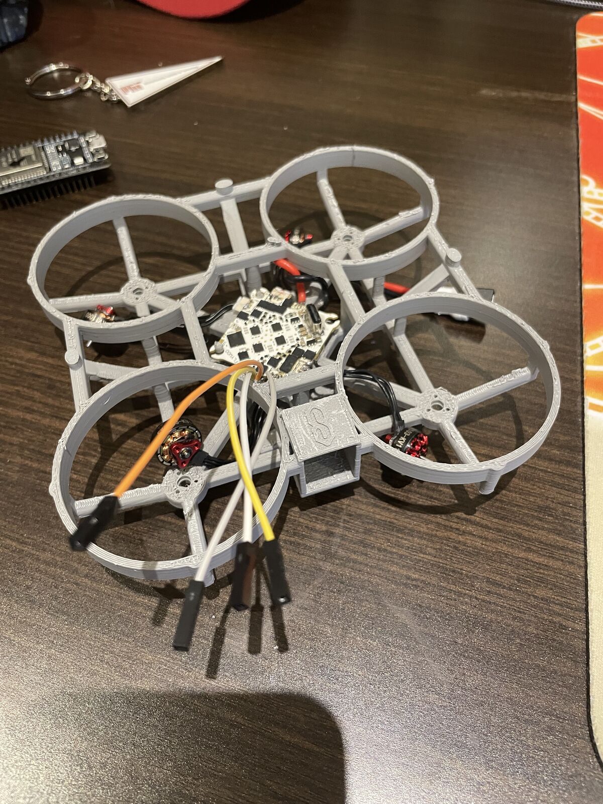 The assembled 3D-printed drone frame with four ducted propellers and motors installed
